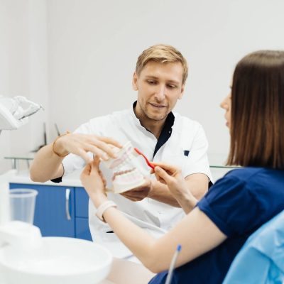 dentist-showing-the-correct-dental-hygiene-on-white-background (1)